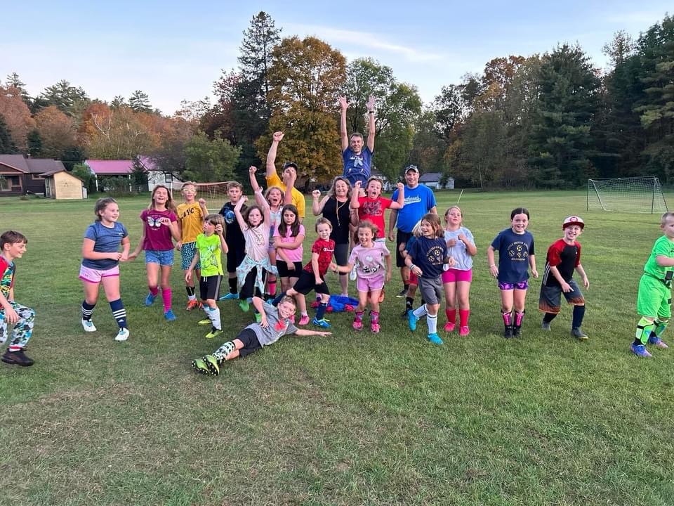 End of year soccer team celebrating
