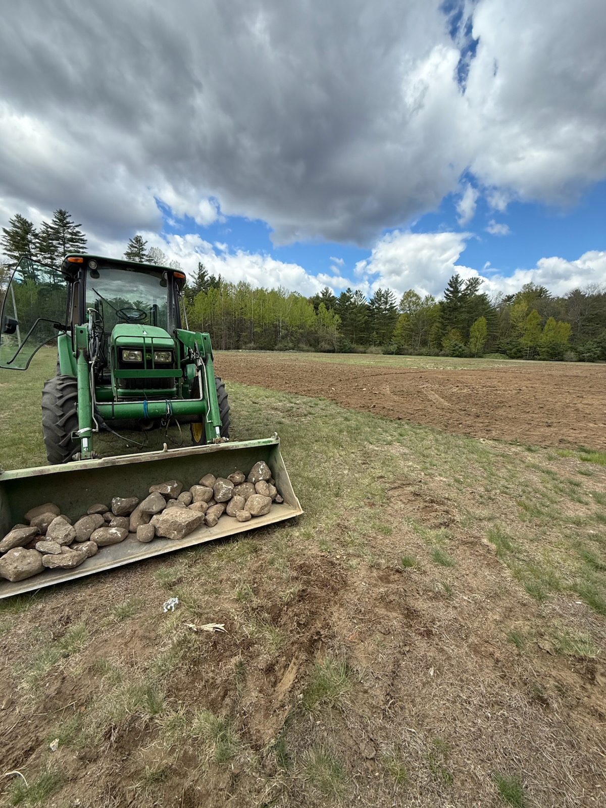 tractor clearing baseball field