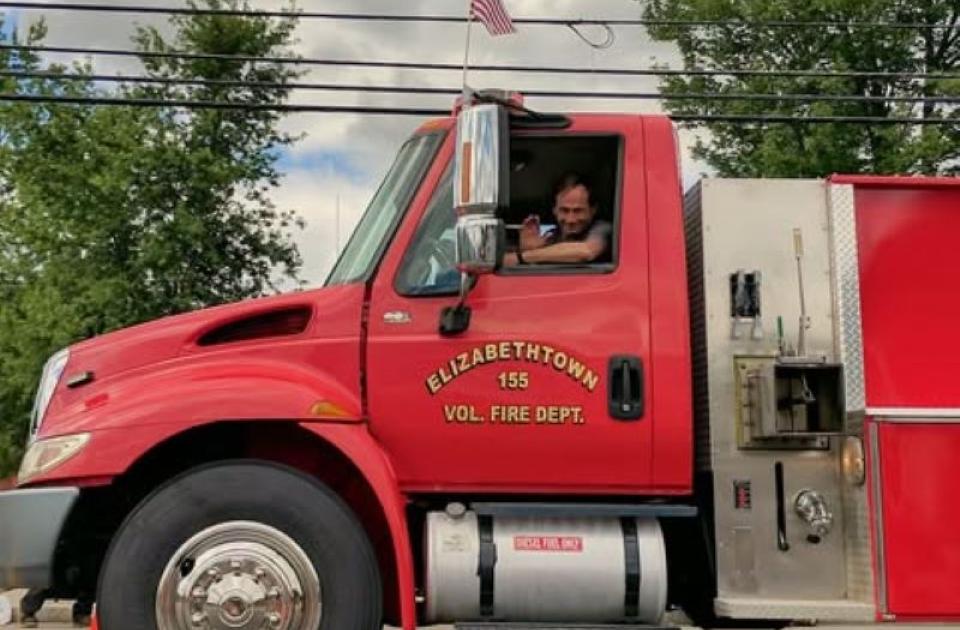 scott in firetruck in parade