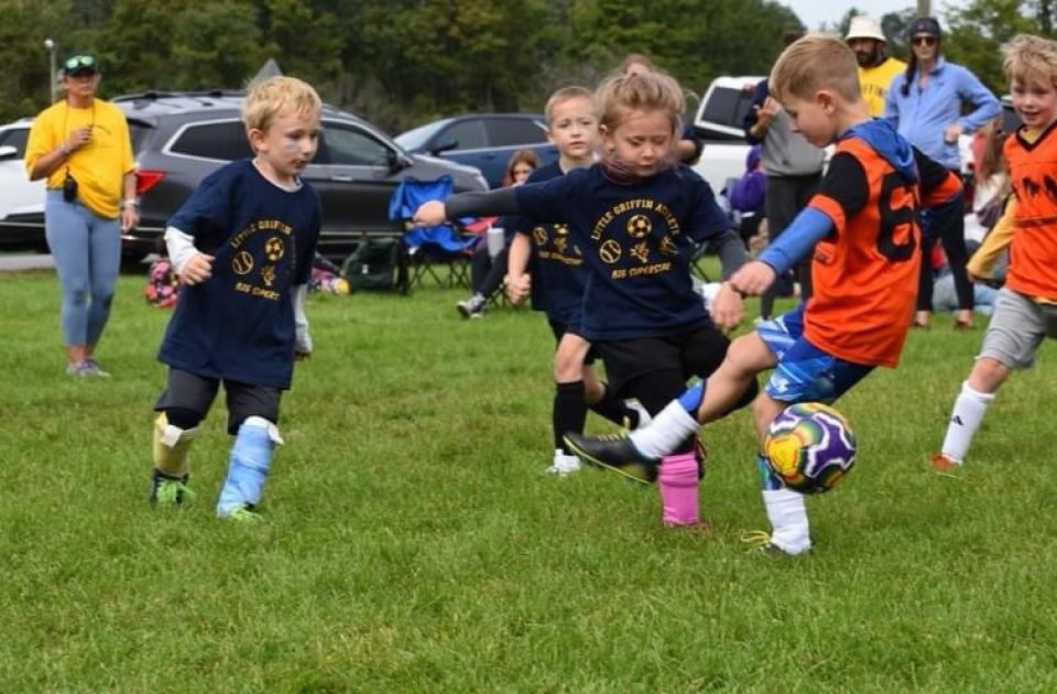 Kindergartneners playing soccer