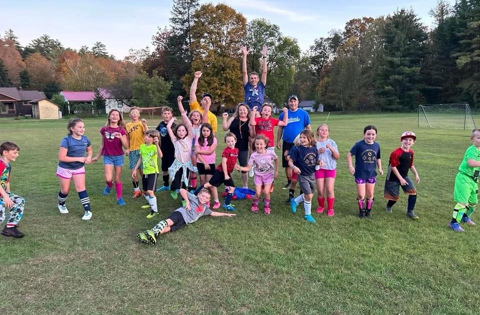 End of year soccer team celebrating
